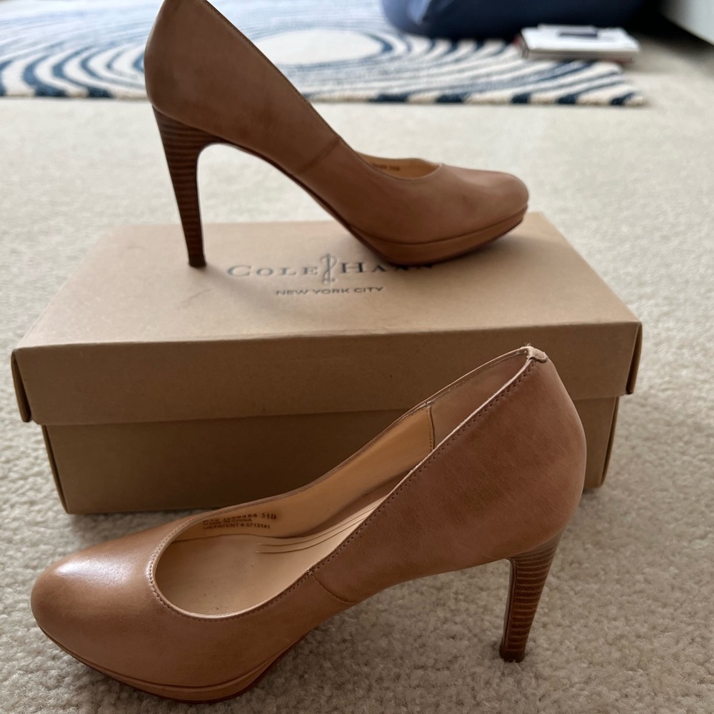 Classic 3 1/2 inch heel pump by Cole Haan. Will make your legs look long!